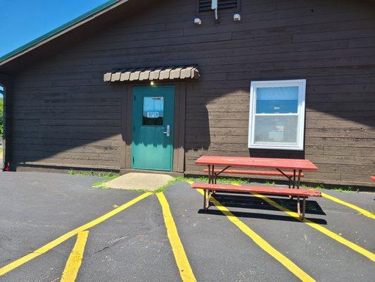 The door closest to the dock and launch also one of the tables you can sit at to dine