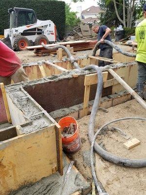 House addition 
Pouring foundation