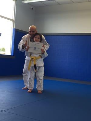 Just one of the many little girls in our class happy to earn her yellow belt