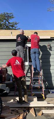 Father and sons working together.