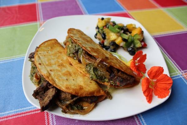 Steak tacos with chimichurri sauce and a Caribbean salad on the side