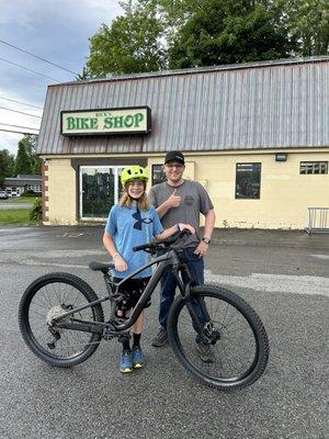 Dillon with his new bike in front of Rick's Bike Shop.