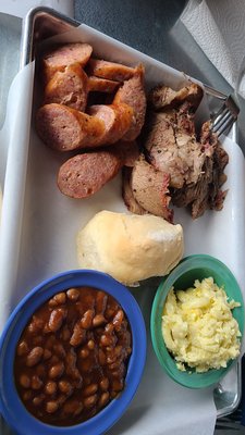 Combo platter: brisket, sausage with baked beans and mac n cheese