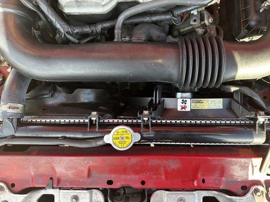 Install the new Radiator Cooling Fan on the right side.