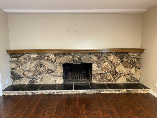 Old rock fireplace, we had removed and replaced by SoCal Fireplace Mantles.