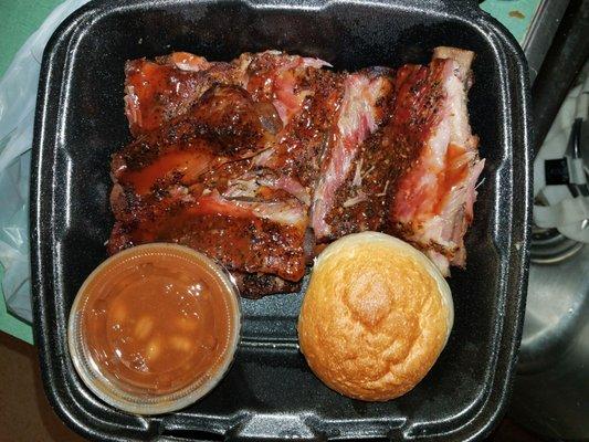 pictured is 1/2 of a full rack of ribs (1 of 2 Styrofoam containers) *each container came w/ bread, beans, and macaroni salad.