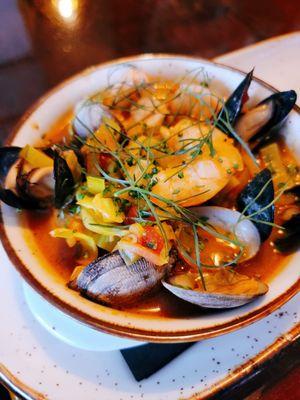 Bouillabaisse with rock fish, mussels, clams in a  light tomato broth