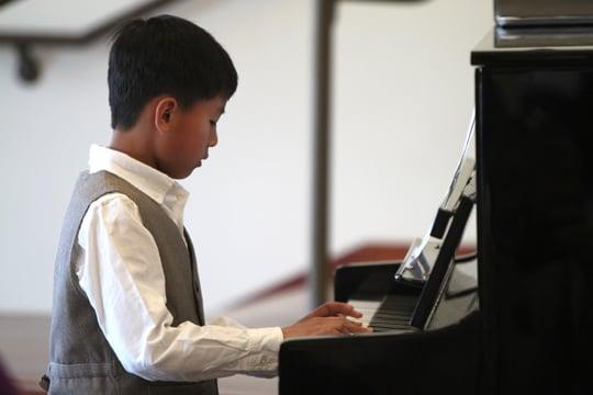 Student performs at a spring recital.