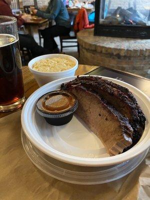 Borealis Beer sitting by the fire with some brisket and Mac from The Forge (carry out)