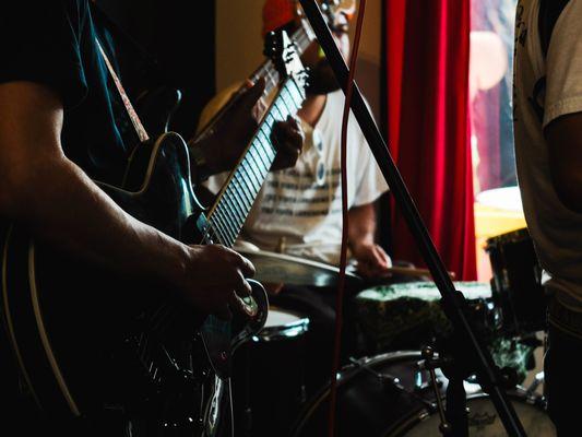 Live music showcase during Vista Alley Art Festival inside the coffee shop.