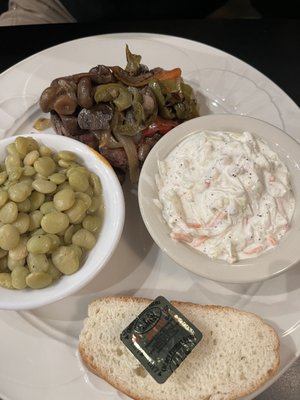 Steak with onions and peppers. Lima beans, coleslaw.