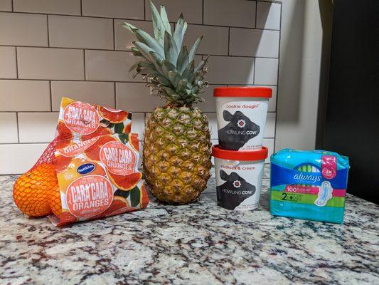 3 pounds of Cara Cara navel oranges for $4.49. Pineapple for $2.49. Howling Cow ice cream, $4.49 per pint. Always Ultra for $3.69.