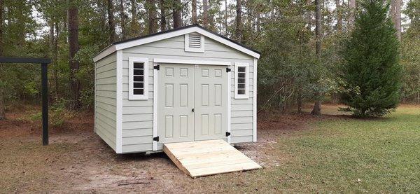 12 x 16 HOA approved shed with LP Smart Lap, custom paint, and a custom ramp installed.