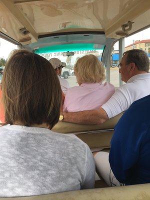 Shuttle, tour guide explaining the local history.