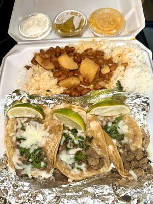 Taco dinner with white rice and Puerto Rican stewed beans.