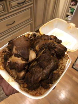 Brown stew chicken, rice and peas