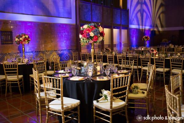 LA Union Station Wedding - black table linens, gold chiavarri chairs, white napkins, gold chargers, silverware, glasses, etc.