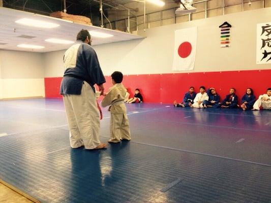 Sensei Tovar teaching this lil' guy