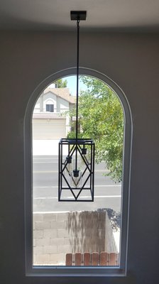 Fixture in tall stairway