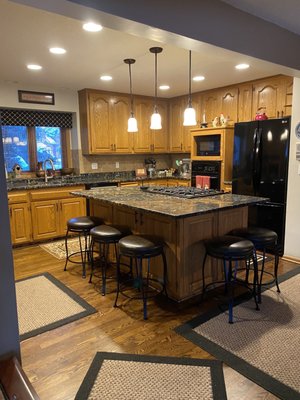 These are the old kitchen cabinets. The old ones were golden oak, and the new ones are called "oyster" colored with a cappuccino glaze.