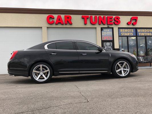 Installed 20inch 5 spoke alloy wheels.  All season Lorenzo tires. 3M brand UV 35% tints all around.  Replaced factory amp and head unit.