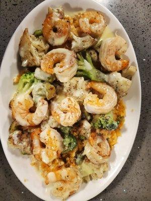 Rocket shrimp! Broccoli,cauliflower and shrimp on a bed of rice topped with cheese sauce.