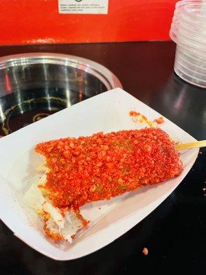 Flaming hot Cheetos rice dog