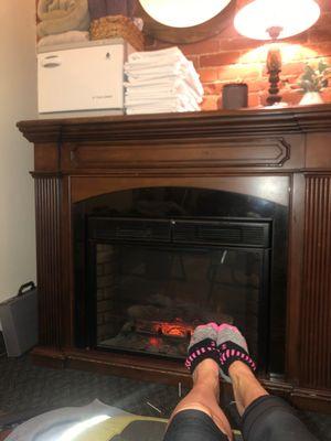 Warm your feet by the fire during treatments!