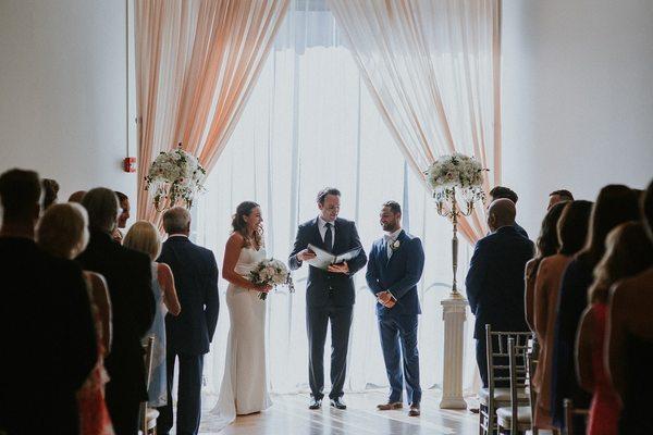 We love hosting ceremonies against our big windows! How gorgeous is this couple?!