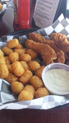 Homemade Chicken Tenders, tater tots, and ranch dressing.