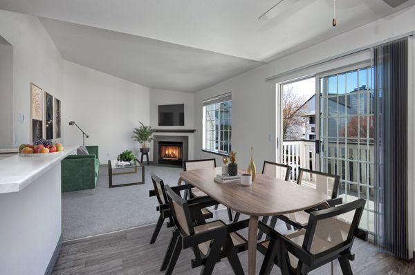 Livingroom room with a wood burning fireplace and dinning room