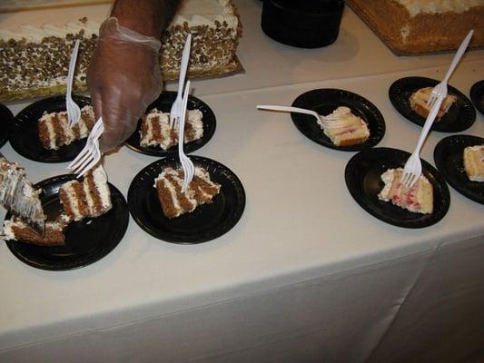 Sample wedding-quality cakes (carrot & white w/ strawberry rum here).  Look, they even wore gloves.