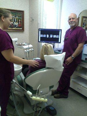 Dr. Chapman reviewing x -rays with a patient.