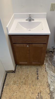 Bathroom vanity with subfloor repair