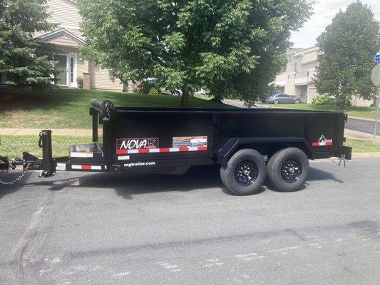 8 yard dump trailer for haul away and delivery service.