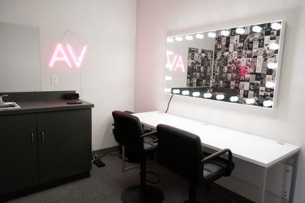 Spacious get ready room! Large vanity, clothing rack, and sink!