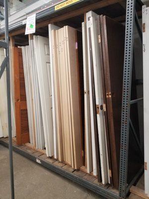 Lots and lots of exterior doors. The sizes are written on the ends. Many styles.