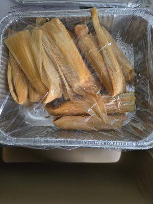 Tamales to go, sold by the dozen. Pork(red). Also offer chicken(green). At the time if thus photo 7/20/24 priced at $25 per dozen.