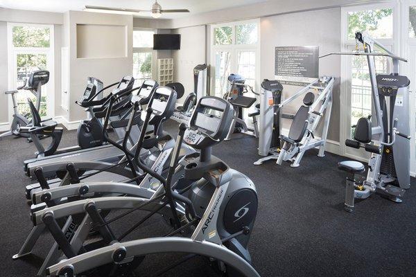 Fully-equipped fitness center with cardio and weight equipment