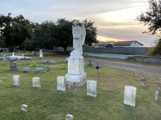 The "Turning Angel" looks over her graves at the Natchez Cemetery...