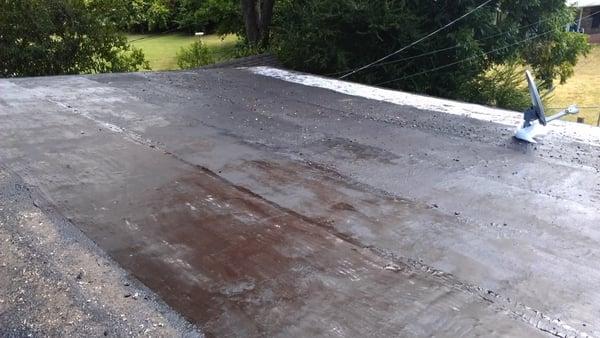 Project - Behre...moving gravel from existing roof. Prepping roof for first application of our system.