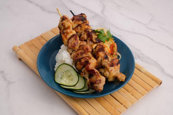 Chicken Skewers marinated with a blend of oyster sauce, lime juice, lemongrass, and seasonings.