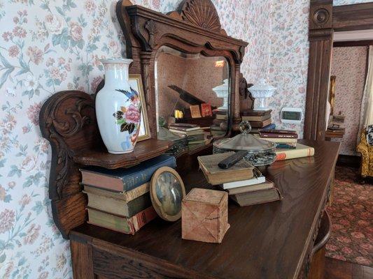 This is a great picture of a antique Murphy bed in the library