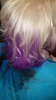 Two-tone blonde and purple underneath her hair