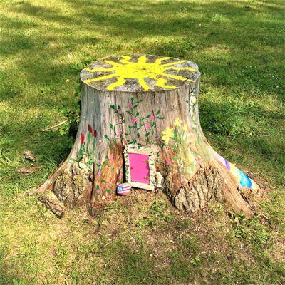 Cute Fairy Tree Stump House for kids to play with. See if you can find it!