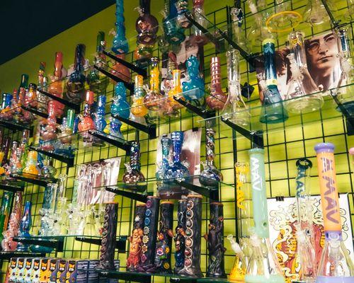 A huge selection of glass, plastic, and polyresin water pipes in a rainbow of different colors.