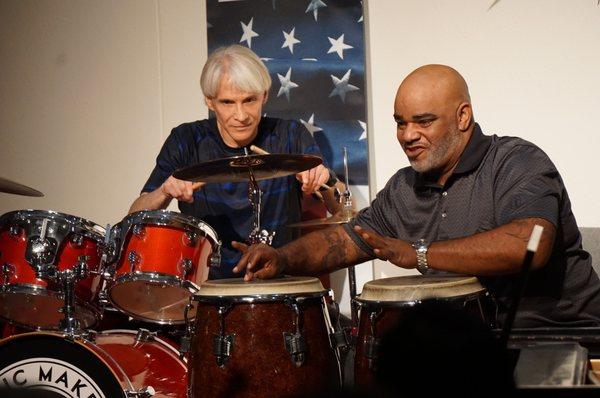 Adult drum student performing with Bucket Baker