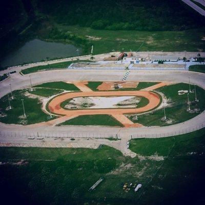 3/8 mile asphalt race track with a 1/8 mile clay go kart track in the center