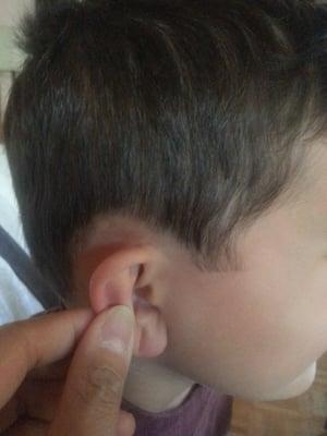 Whitewalls over his ears.  Oh and even these are uneven!  And look at that sideburn.  Wtf?!