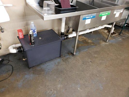 Commercial grease interceptor installation.